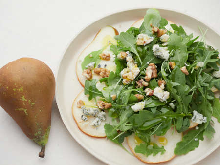 pear salad with rocket cheese and walnutの写真素材