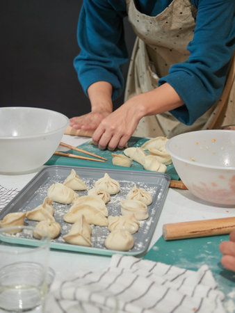 woman making traditional dim sum Chinese dumplings, stuffed doughの写真素材