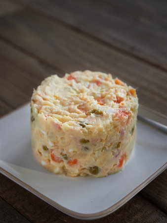 Typical spanish tapa called Russian salad or ensaladilla rusa. Potato salad with tuna and mayonnaise. Close up view, selective focus.の写真素材