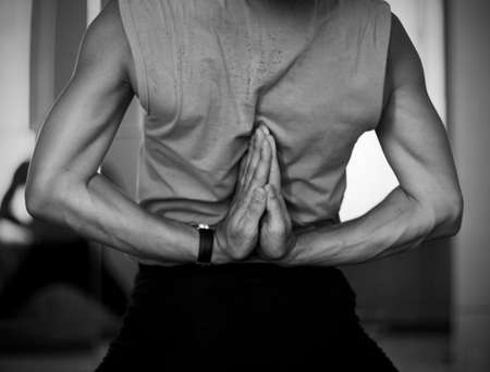 male arms doing yogaの写真素材