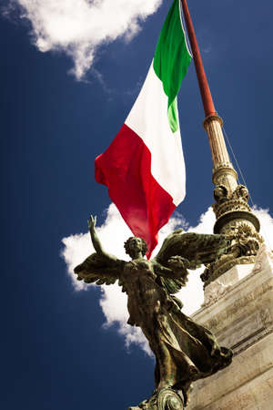 Sculpture on the background of the Italian flagの写真素材