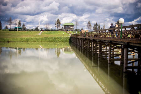 Landscape with woden bridge across the riverのeditorial素材