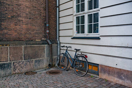 Classic Vintage Bicycle standing near house on street in Malmo, Swedenの写真素材