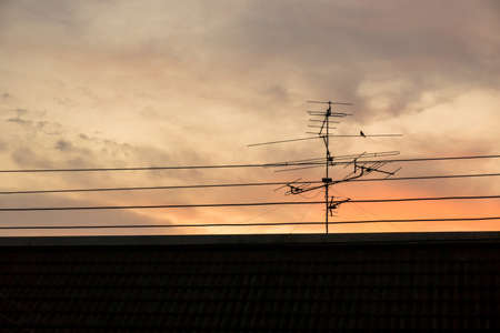 Sunset at roof with antenna.の写真素材