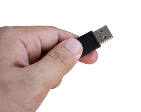 Hand holding USB standarda plug.の写真素材