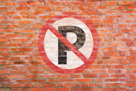 No parking old sign paint on old brick wall, P symbol in red circle on white backgroundの写真素材