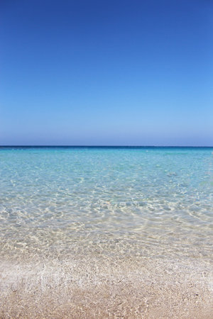 Tropical background with white sand beach, blue sea and perfect skyの写真素材