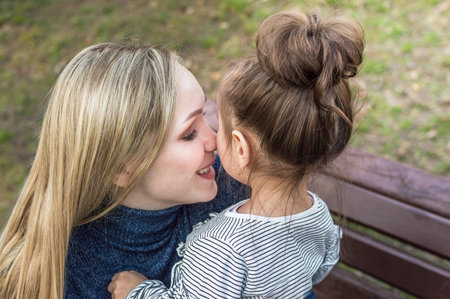 portrait of young woman and little girl close-up. swish