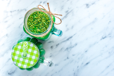 Two Broccoli Smoothies on a marble light background close-up. Healthy eating conceptの写真素材