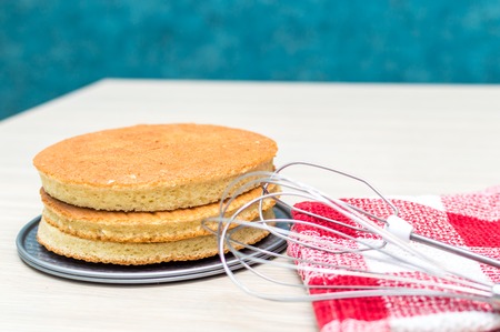 Sponge cake cakes on the kitchen table. Cake making processの写真素材
