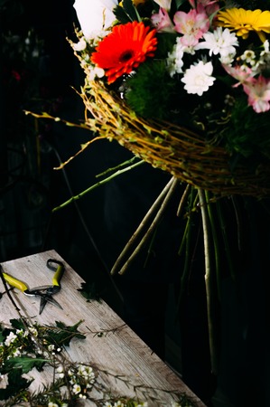 process of creating a creative large bouquet of flowers. Black background. Concept floristの写真素材