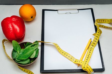 Healthy products and meter on table in nutritionist's office. Close upの写真素材