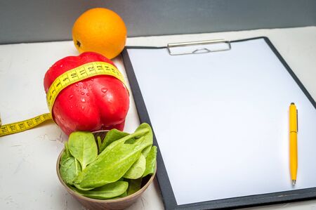Concept doctor nutritionist. Vegetables and fruits on the table. Mock upの写真素材