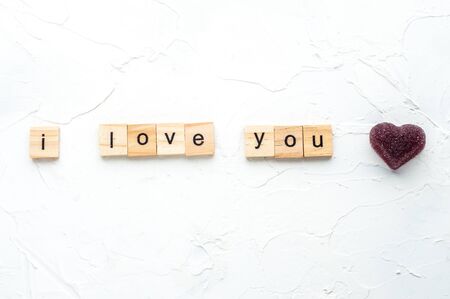 inscription I love you is laid out in wooden letters on a white wooden background. Valentine's day concept. February.の写真素材