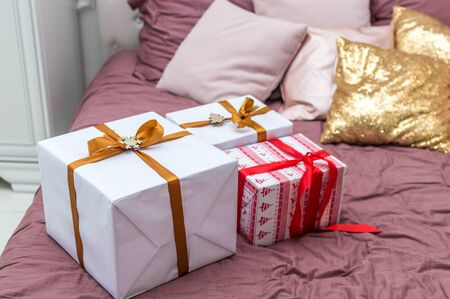 Gifts on the bed close-upの写真素材