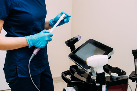 Aesthetic gynecology. Intimate rejuvenation. doctor works with the device