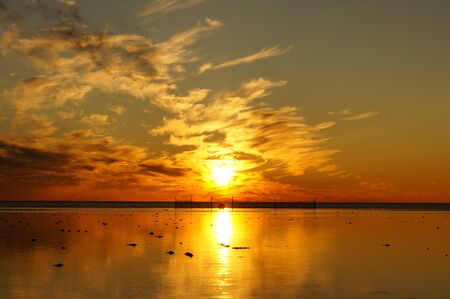 Golden Sunset and the White Sea in summer seasonの写真素材