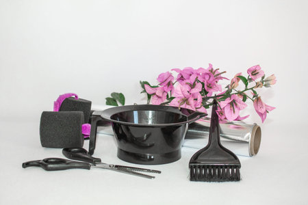 Tools for hair dye and hairdye white background.Barber set with hair dye, foil and brush, scissors...