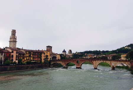 The bridge over the river leading to the old center of Veronaの写真素材