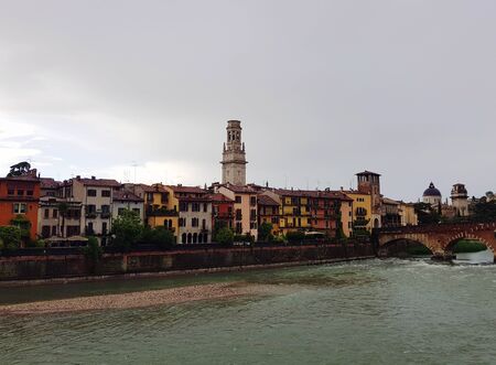 The bridge over the river leading to the old center of Veronaの写真素材