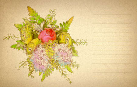 bouquet of colorful flowers on a beige textured paper lined for a letter      の写真素材
