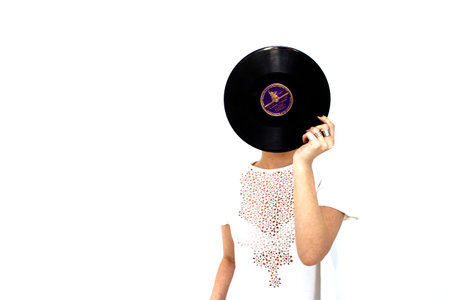 Girl with vinyl recordの写真素材