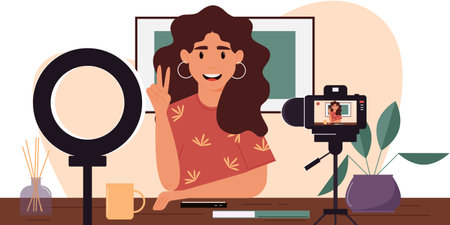 Young female blogger records herself on video using a video camera and a light lamp. Vector character creating a video review for a blog.Vlogger cartoon character records video indoors. Flat designのイラスト素材