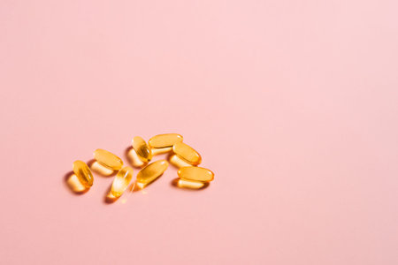 Pills on pink table. Medical, pharmacy and healthcare concept. Copy space. Empty place for text or...