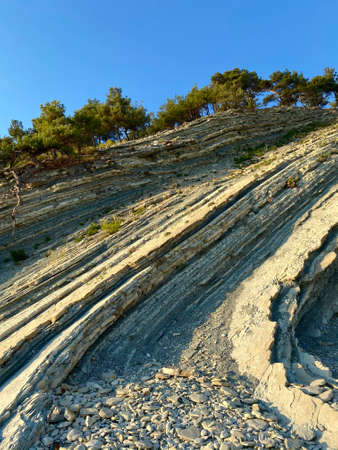 Unusually beautiful relief of the mountain. An unusual place in the south of Russia. Wild beach. Mountain view at sunsetの写真素材