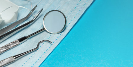 Set of medical dental equipment and dental floos on blue background. copy spaceの写真素材