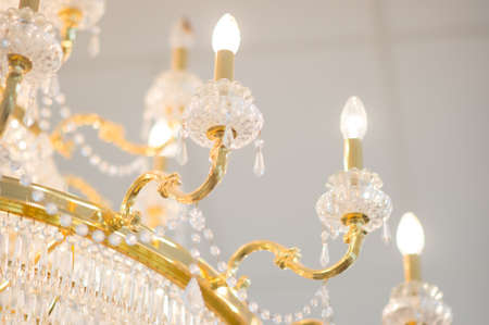 The close up of gold crystal chandelierの写真素材