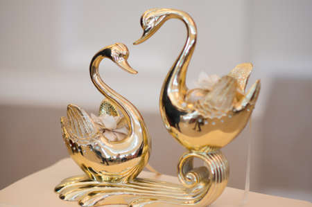 The statuette of a pair of swans. Symbol of love and faithfulnessの写真素材