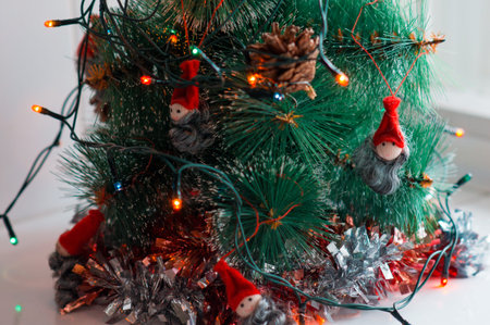 Christmas theme background. Decorated Christmas tree with colorful garlands