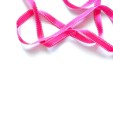 Pink ribbon on white backgroundの写真素材