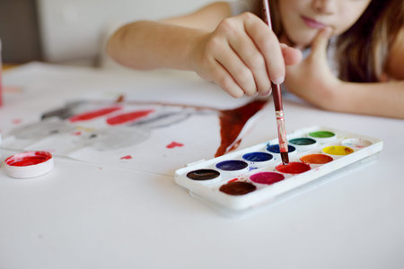 The girl of the house draws for St. Valentines Day of birds in loveの写真素材