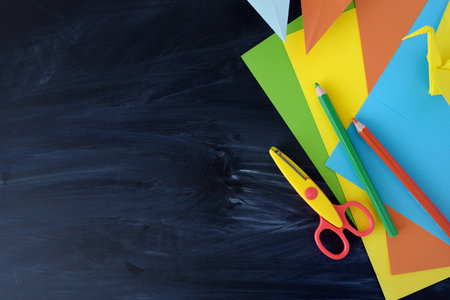 Color paper cranes of origami from paper on a black backgroundの写真素材