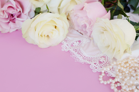 Gift, pearls, gentle roses on a pink background.の写真素材