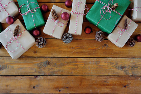 Christmas presents laid on a wooden table background