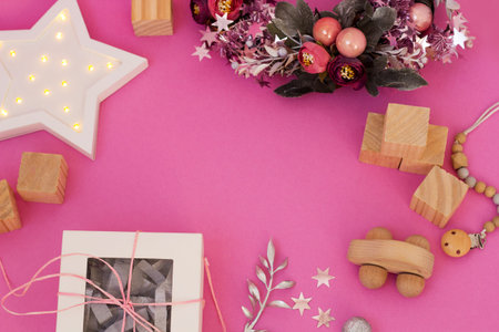 Christmas card with Holiday presents for Kids top view. Ecological Baby toys flatly. Banner with copy spaceの写真素材