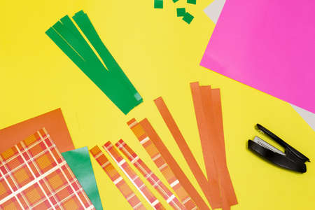 Handmade craft project. Creative DIY concept. Making carrots garland for Easter. Step by step photo instruction. Step 2の写真素材