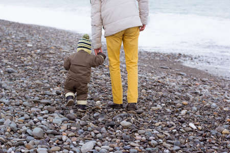 Father and son together at the sea. Family time boy with dadの写真素材