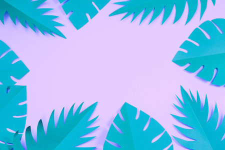 Tropical party decor top view. Paper palm and monstera leaves frame. Banner with Copy Space for...