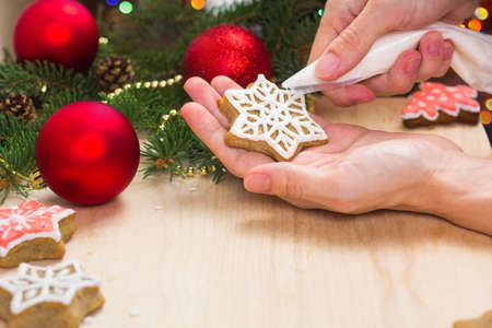 Making gingerbread. Cooking Christmas food. Traditional holiday hand made cookie.の写真素材
