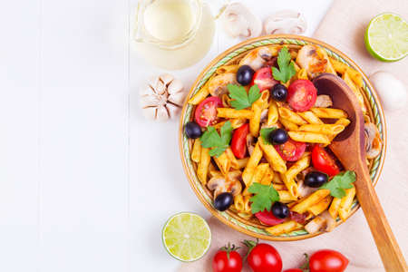 Classic Italian pasta with ingredients on a wooden backgroundの写真素材