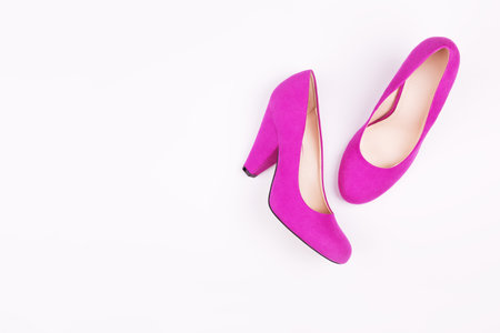 Purple female shoes on a white background. Concept idea. Flat lay, fashion trendy background.の写真素材