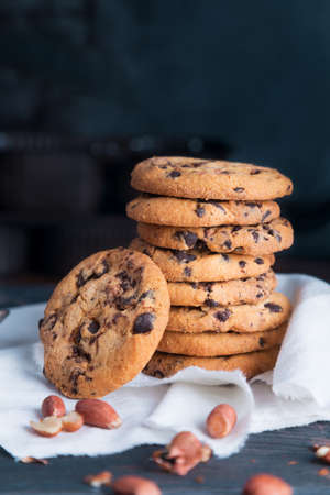 Homemade chocolate chip cookies and peanut on dark grunge background. Space for textの写真素材