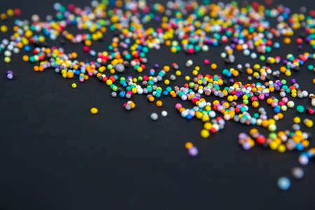 multicolored beads on a black background close-up. High quality photoの写真素材