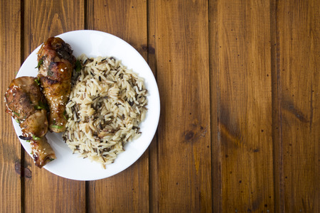 cooked rice with fried chicken legsの写真素材