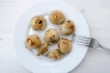 Fried dumplings on a plate.