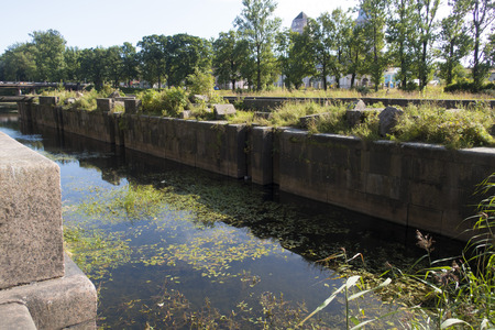 water channel with standing water in the cityの写真素材
